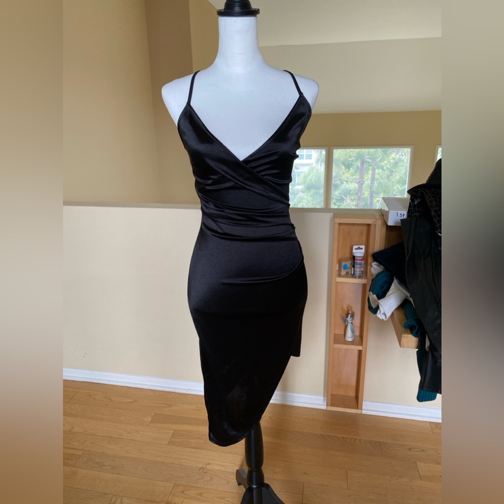 Price drop for summer - tight little black dress. If you got the bod flaunt it!